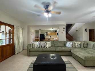 Covered outdoor terrace with BBQ and dining space at Playa Blanca Resort Farallon Panama house for rent