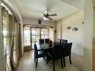 Bright bedroom with natural light, ceiling fan and AC in house for rent at Playa Blanca Resort Panama