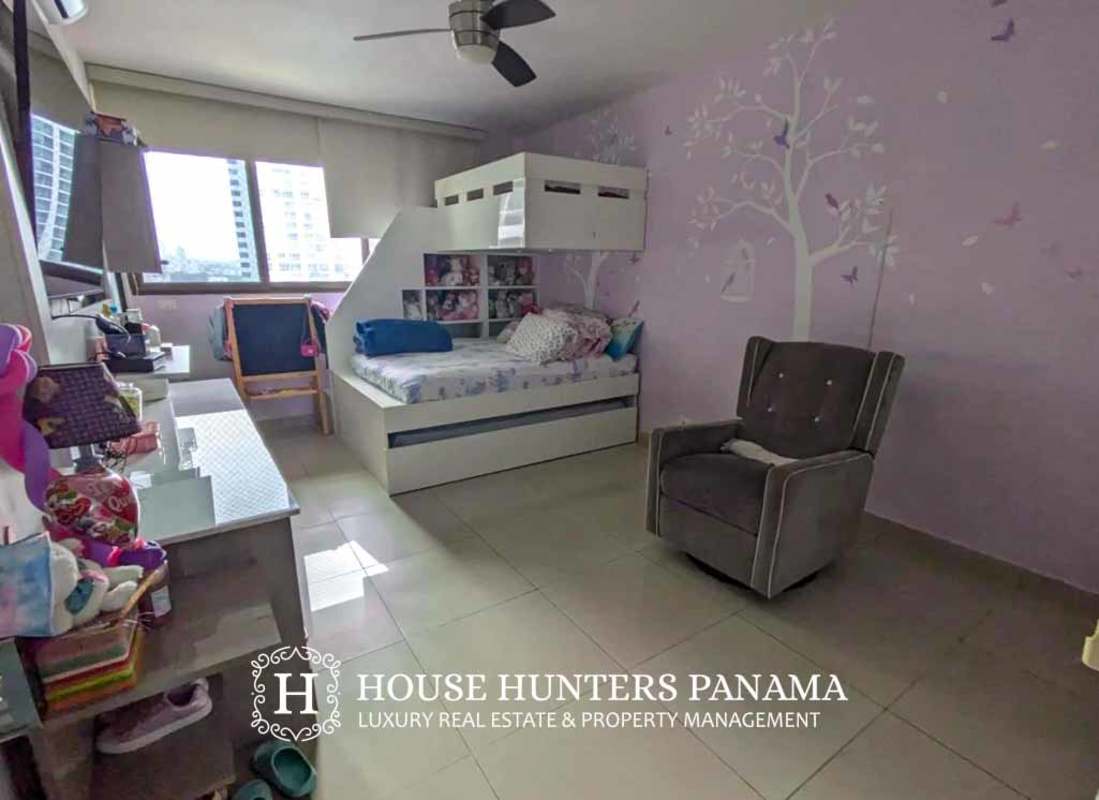 Kids room featuring bunk bed, play decor, and city views in Panama City condo