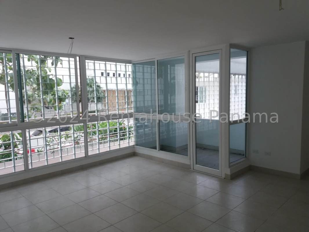 Dark wood cabinets and granite countertops in kitchen at PH Edison Park Panama