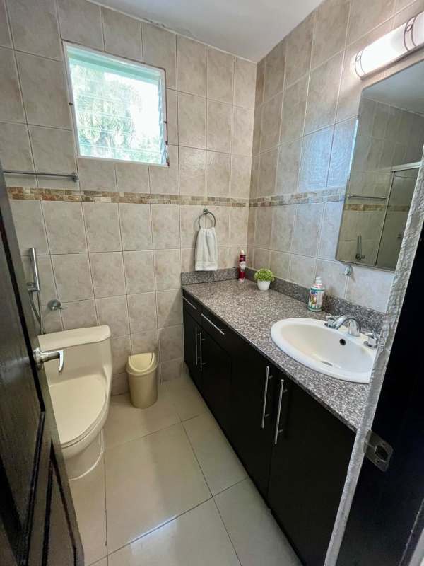 Bathroom with glass shower, granite countertop in PH Sun City Clayton Albrook Panama City