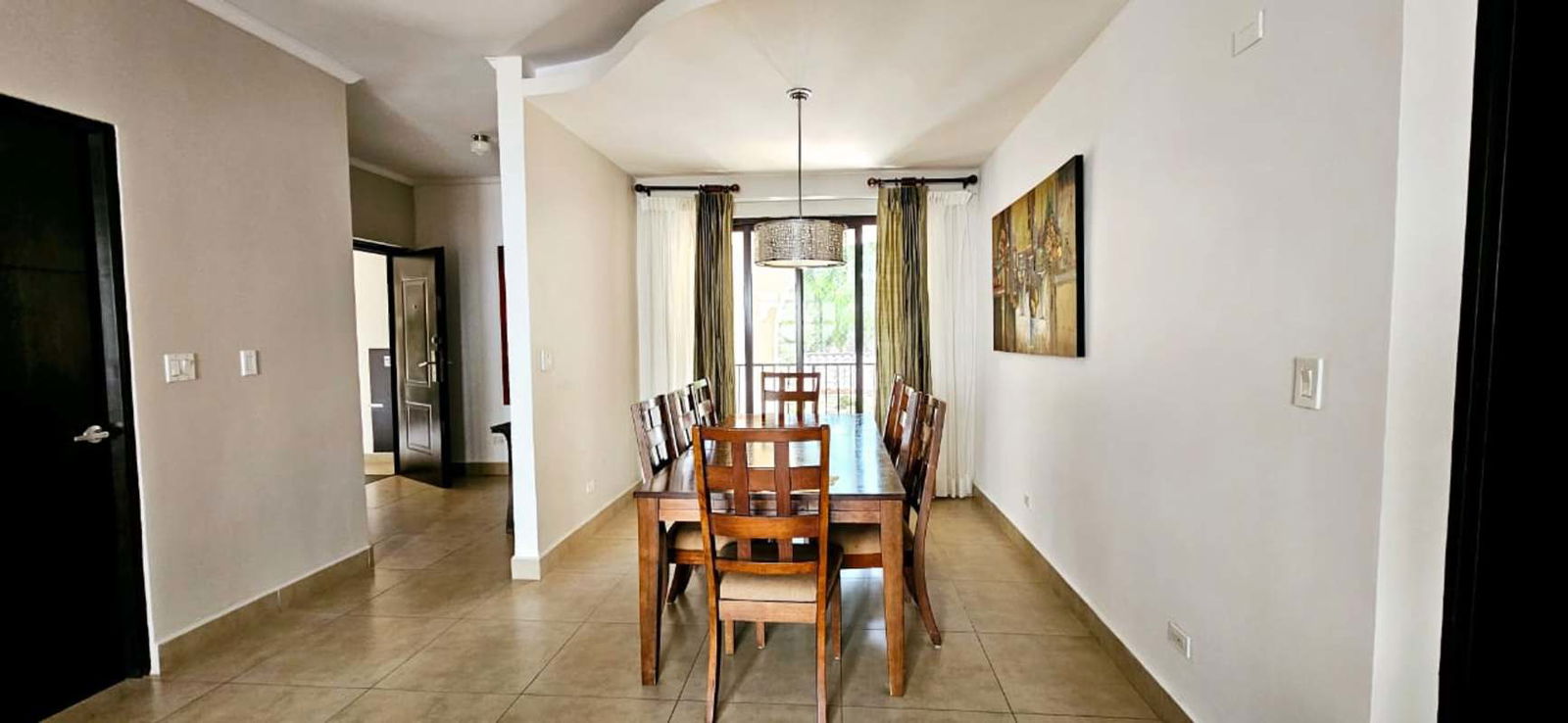 Large open plan tiled living dining room with natural light Albrook Embassy Village Panama