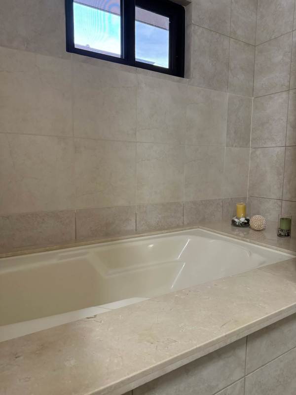 Bathroom with glass shower and contemporary finishes Embassy Club Clayton Panama