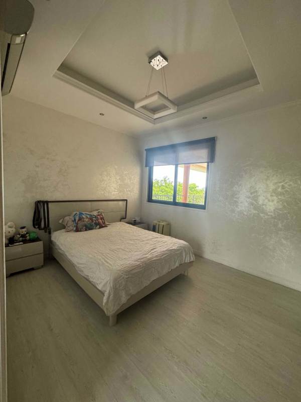 Large modern master bedroom balcony access luxury penthouse Clayton Embassy Club Panama