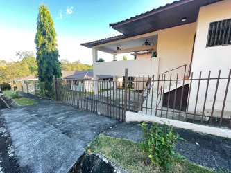 Shaded terrace with ceiling fan, garden views in San Carlitos David Panama