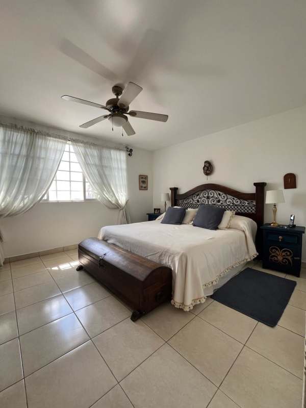 Outdoor patio with private swimming pool, lush landscaping and terrace bar in Residencial Mirador Hill Villa Lucre Panama