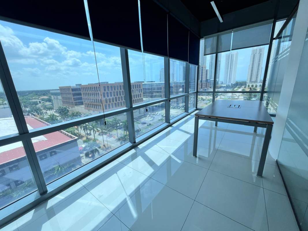 Private office area with glass wall and skyline view Time Square Center Panama City