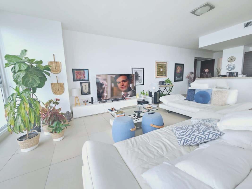 Contemporary living area in PH Oceanaire Punta Pacifica with skyline and ocean view through large windows