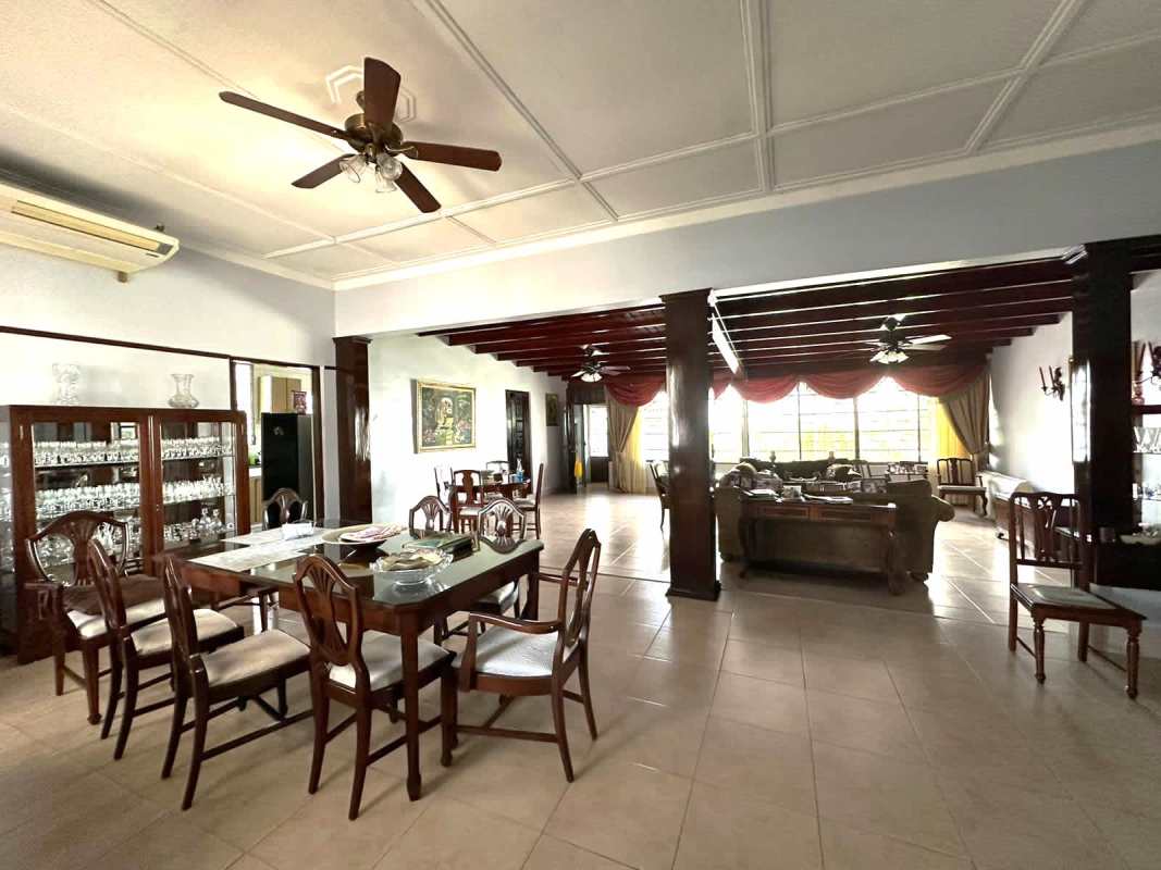 Multipurpose room with desk, seating and windows in single family house for sale in Panama City