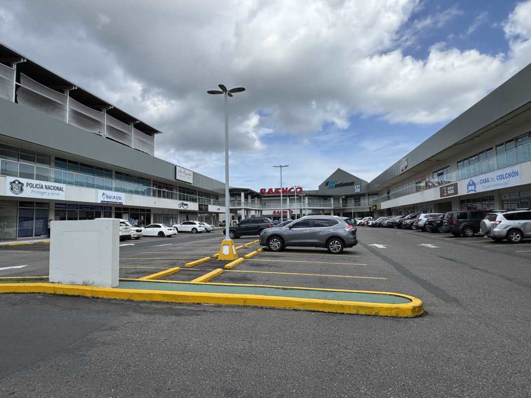 Large unfinished open space with exposed ceiling beams in Costa Sur commercial plaza Panama