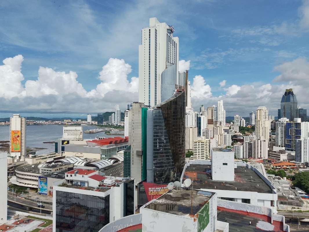 Outdoor pool deck with panoramic city view at PH Arrecife condominium Panama