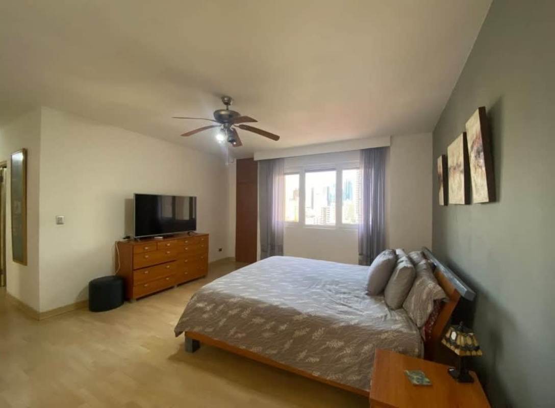 Bedroom with wood flooring city view large window PH Vistanova Panama