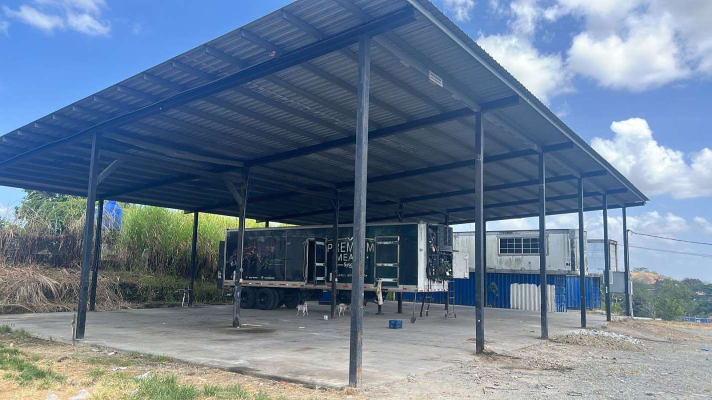 Metal covered warehouse with truck trailer parking and container offices on commercial lot in Rana de Oro Pedregal Panama
