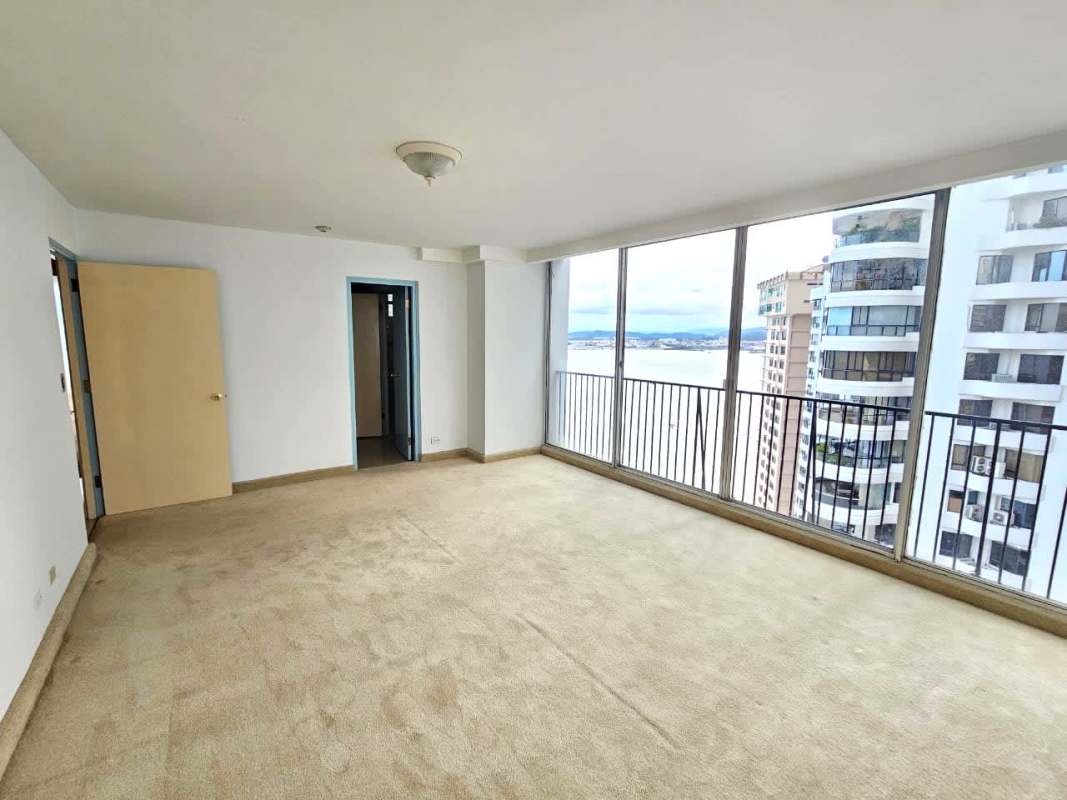 Unfurnished living room with large panoramic windows and sea views at Mirador Marino, Punta Paitilla Panama City