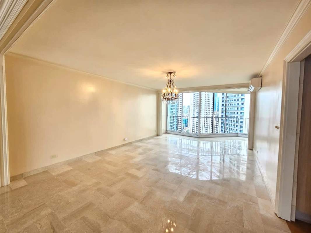 Living room with large windows, marble flooring and balcony ocean view in PH Mirador Marino Panama City