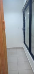 Narrow indoor space with sliding window and tile floor in Plaza Oeste Commercial
