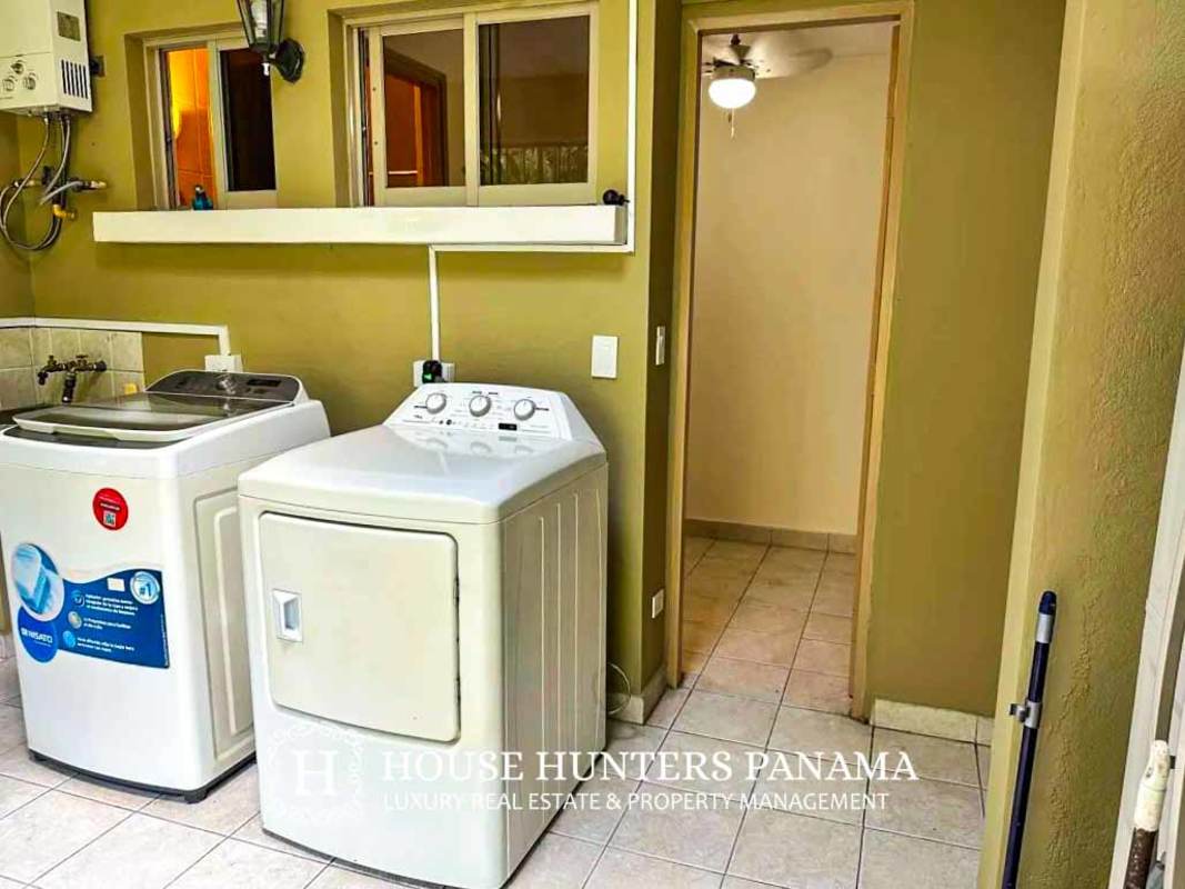 Contemporary bathroom with granite double sink vanity, glass shower and bathtub at Embassy Club Clayton