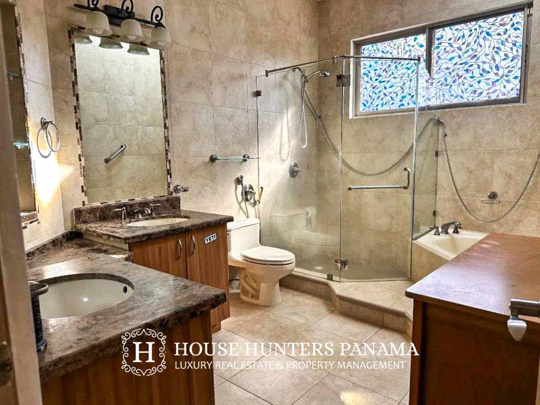 Spacious kitchen with granite countertops, wooden cabinets, stainless appliances in Embassy Club Clayton Panama City