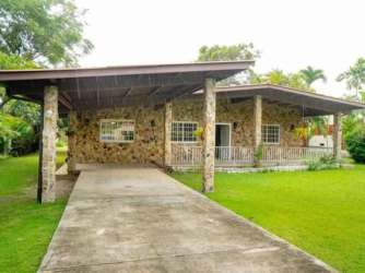 Spacious living and dining room with modern furnishings at beach house Gorgona Panama