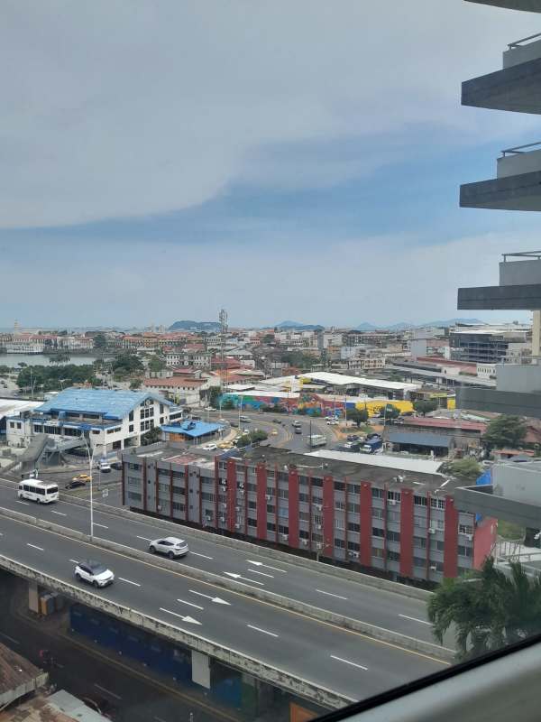 Empty office with ceramic floors and panoramic windows overlooking oceanfront in Bay View Tower Panama City