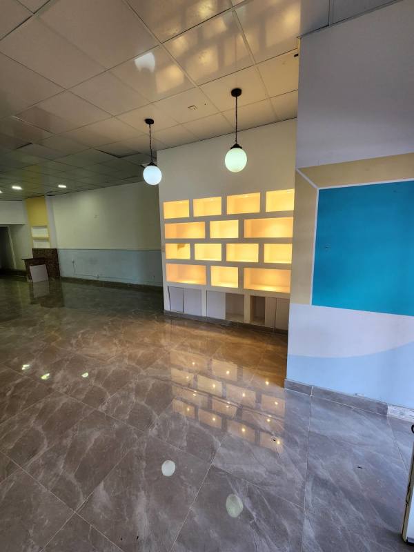 Spacious lobby or commercial hall with marble floors and modern lighting Brisas Commercial Plaza Brisas del Golf Panama