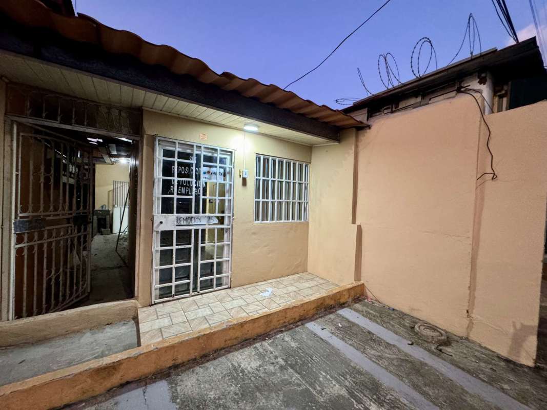 Steel gates and concrete driveway secured urban commercial property Parque Lefevre Panama