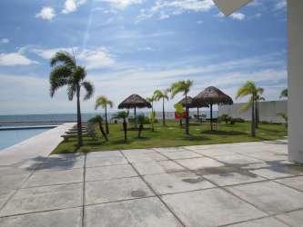 Stylish bathroom with vanity and glass shower enclosure at Royal Palm Panama beachfront condo