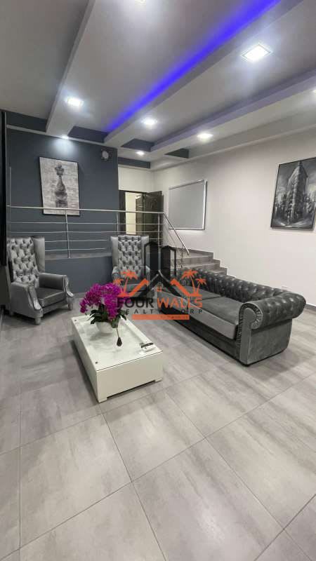 Spacious living room with porcelain floors and large windows in rental house at Altos del Parque Residences Panama