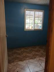 Interior space with blue walls, tiled flooring apartment rental Nuevo Chorrillo