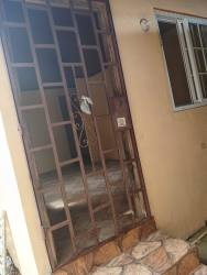 Simple bedroom with tiled floor and window natural light in apartment for rent Arraiján