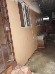 Empty room with blue walls, tiled floor, window Nuevo Chorrillo Apartment Arraiján Panama