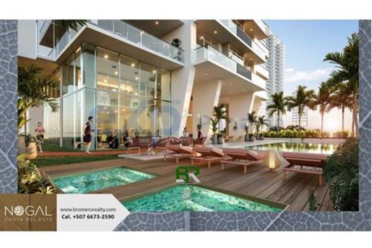 Luxury condominium swimming pool with jacuzzi and lounge chairs in PH Nogal Costa del Este Panama