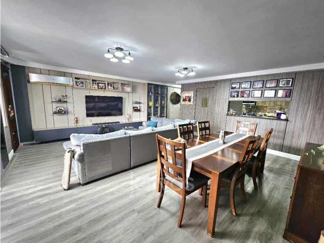 Bright semi-open kitchen with granite countertops, wooden cabinetry, decorative backsplash
