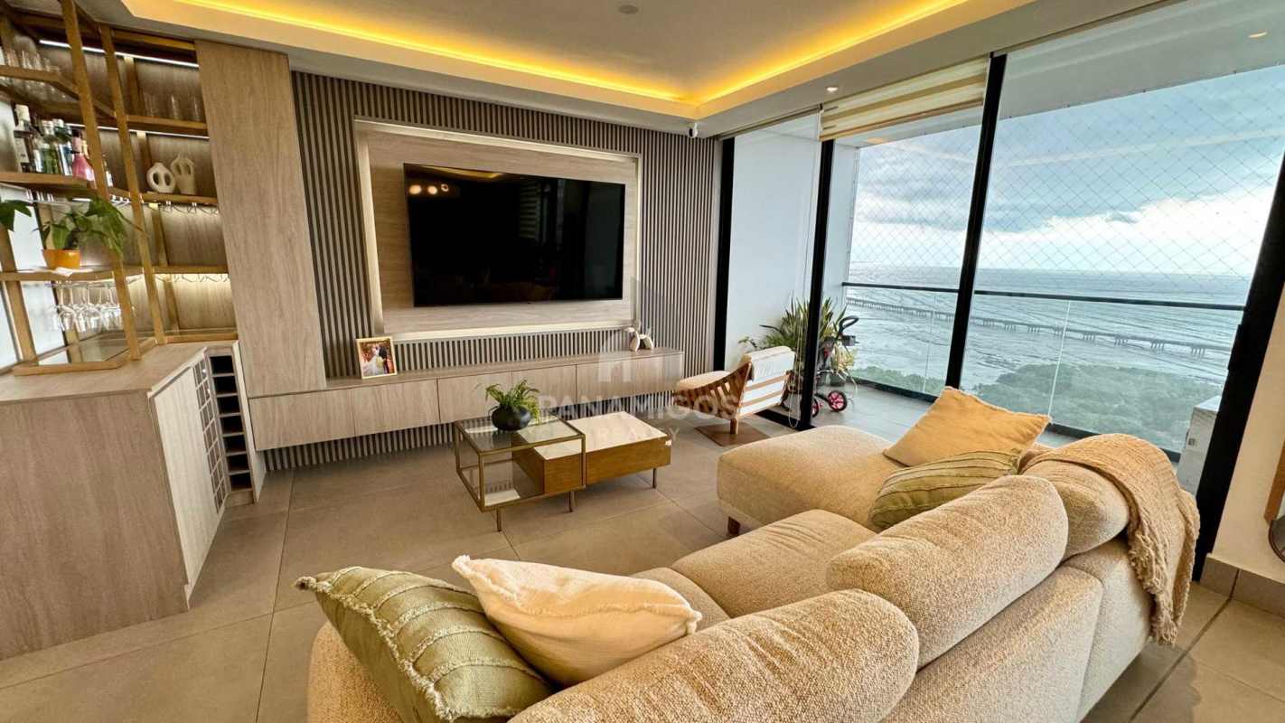 Spacious modern living room with sectional sofa ocean view balcony Coco del Mar