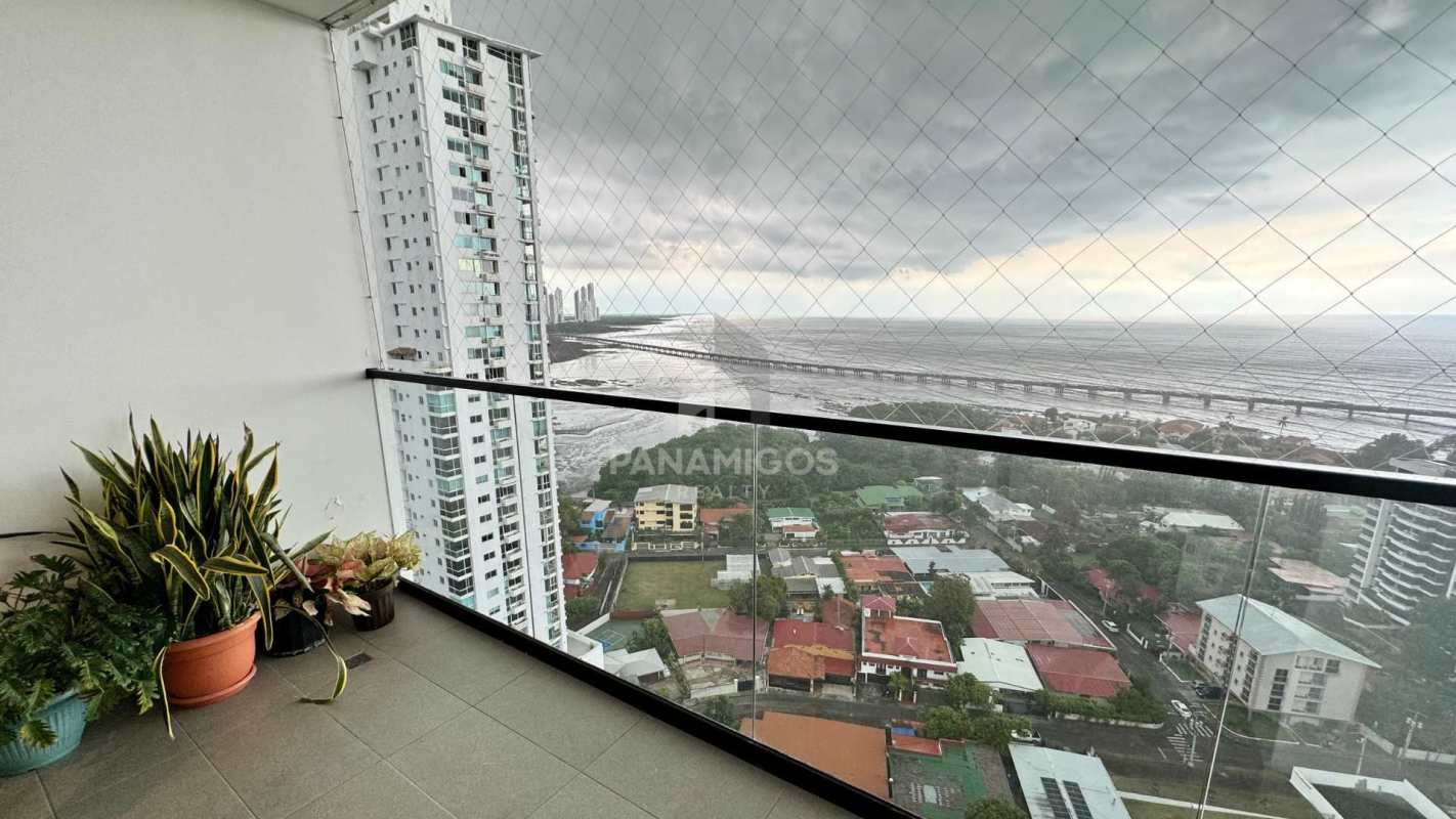 Balcony overlooking coast and city skyline from Victory Wellness high-rise