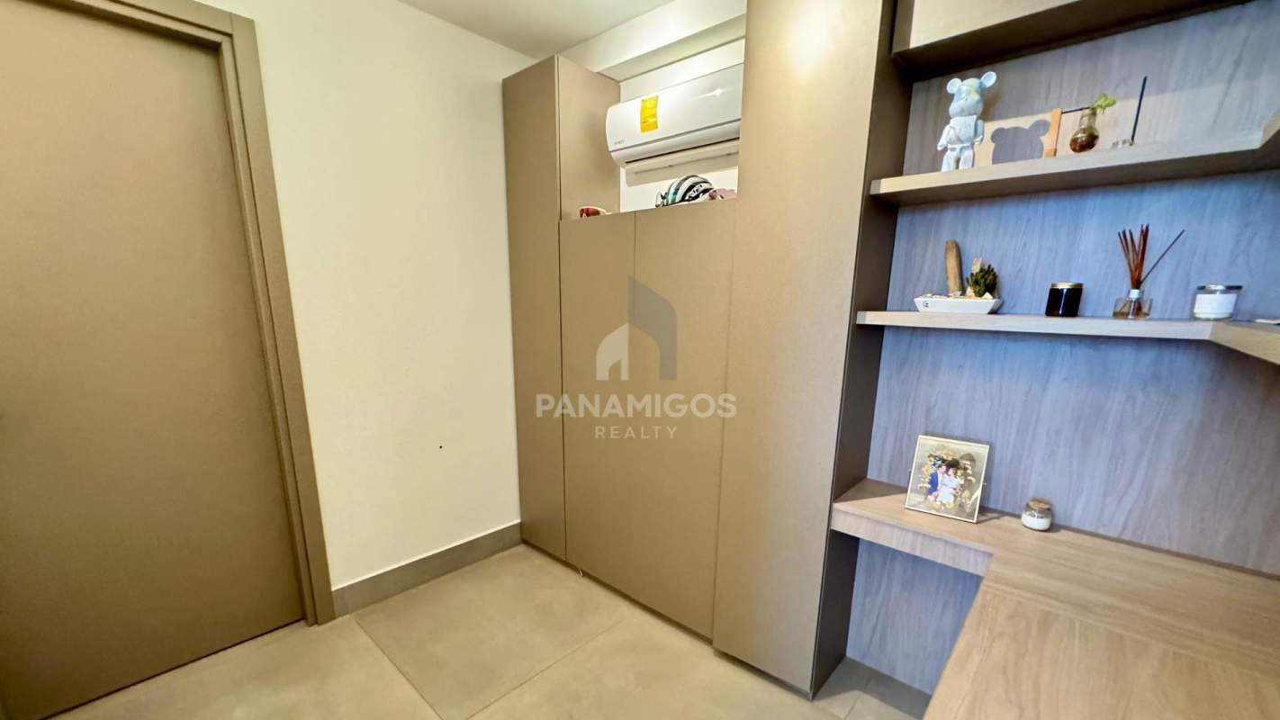 Minimalist entry hall with built-in shelves in luxury condo Panama