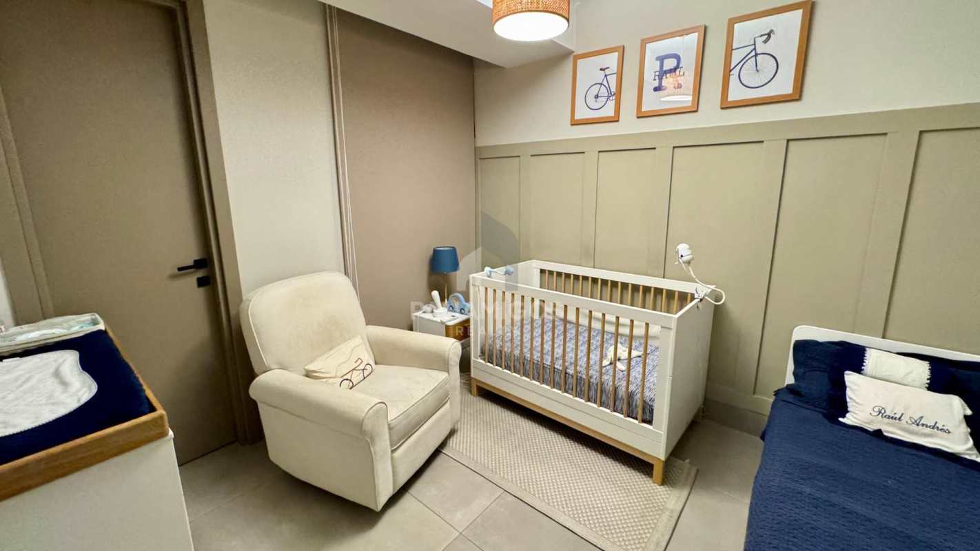 Modern nursery with beige decor and large window at Coco del Mar Panama