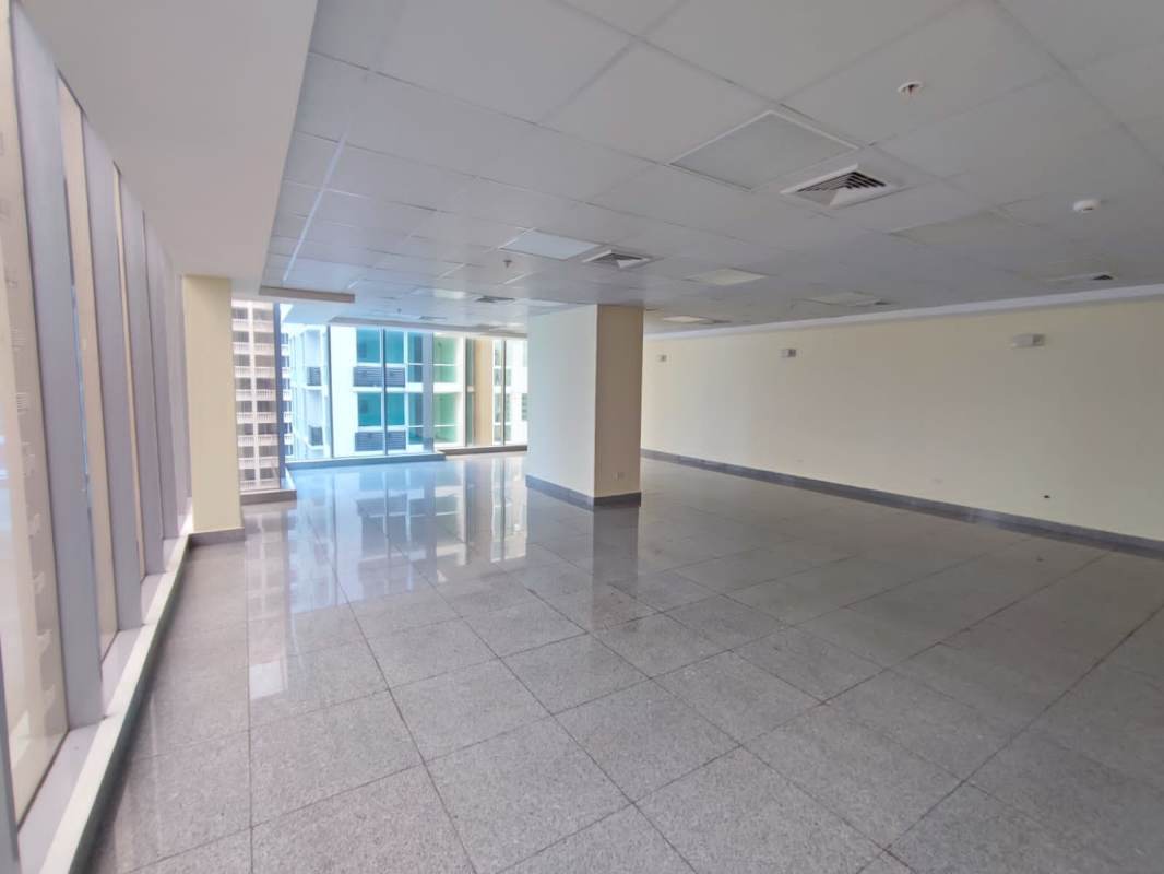 Empty open-plan commercial office at Torre SFC with tiled floors and city view windows Panama
