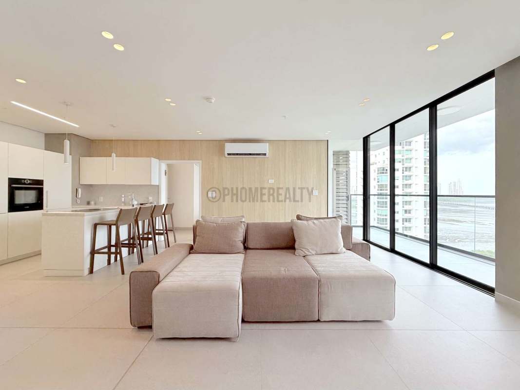 Luxury kitchen with island, white cabinets, modern appliances and open layout in Ocean House Coco del Mar Panama