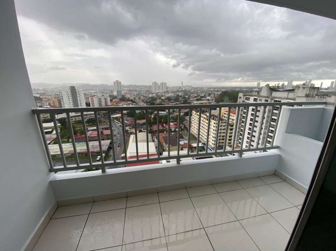 High-rise apartment balcony with panoramic city view at PH Solok Parque Lefevre