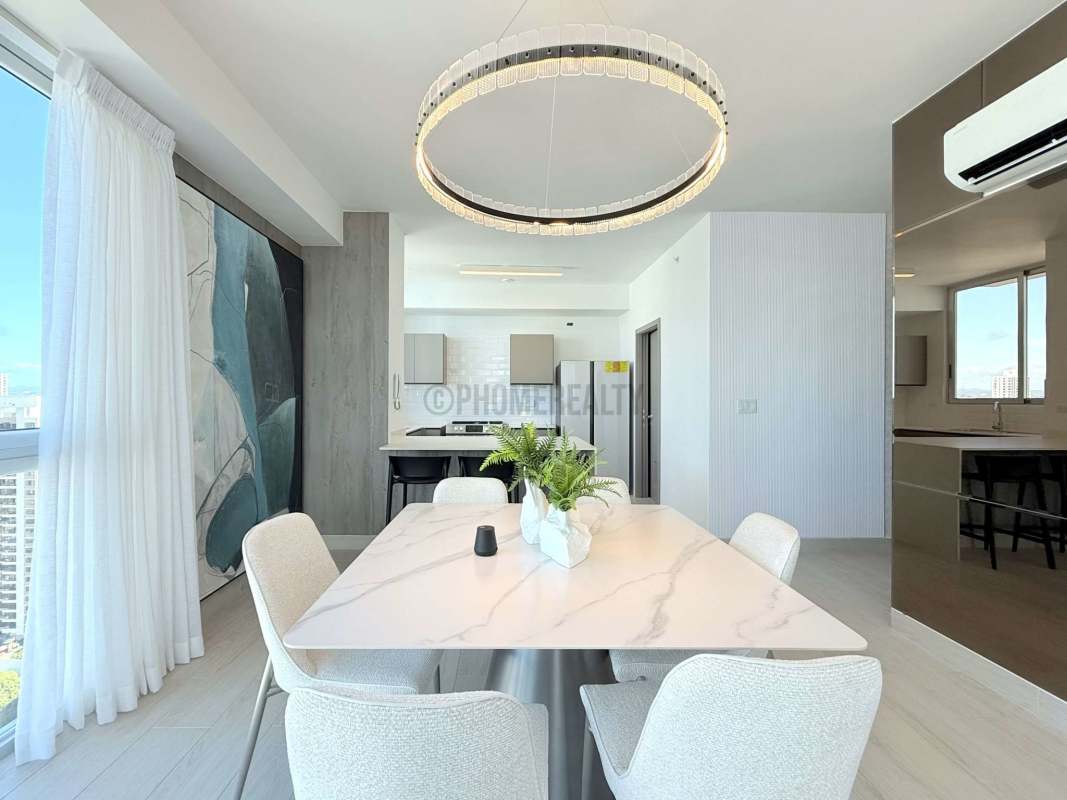 Contemporary dining area adjacent to modern kitchen in luxury condo Obarrio Panama City