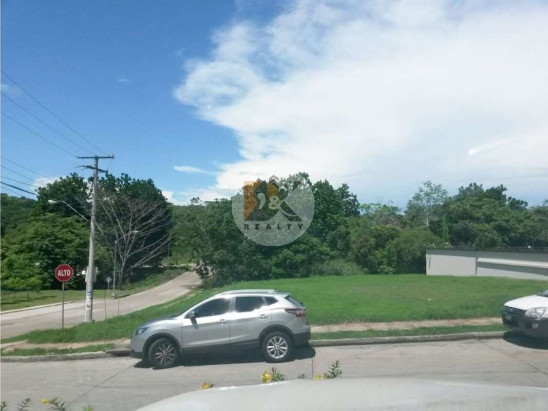 Commercial vacant lot with street sidewalk and lush greenery corner lot Clayton Panama