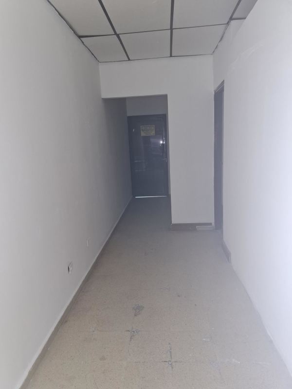 Modern commercial building with curved glass facade in Villa de las Fuentes Panama