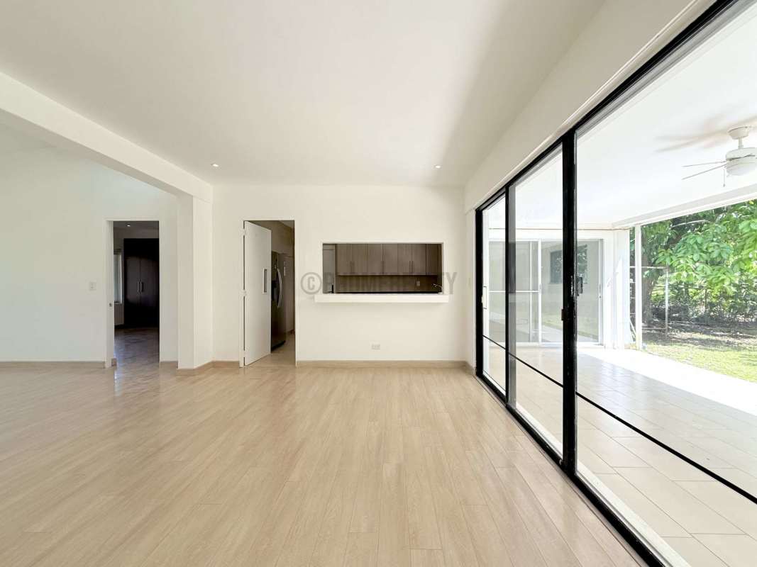 Contemporary kitchen with granite counters, light wood cabinets in Clayton Panama