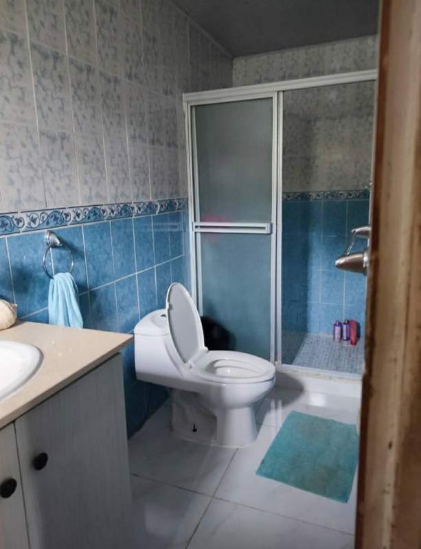 Dining room with natural light, wooden ceiling, patterned curtains Pedregal Panama