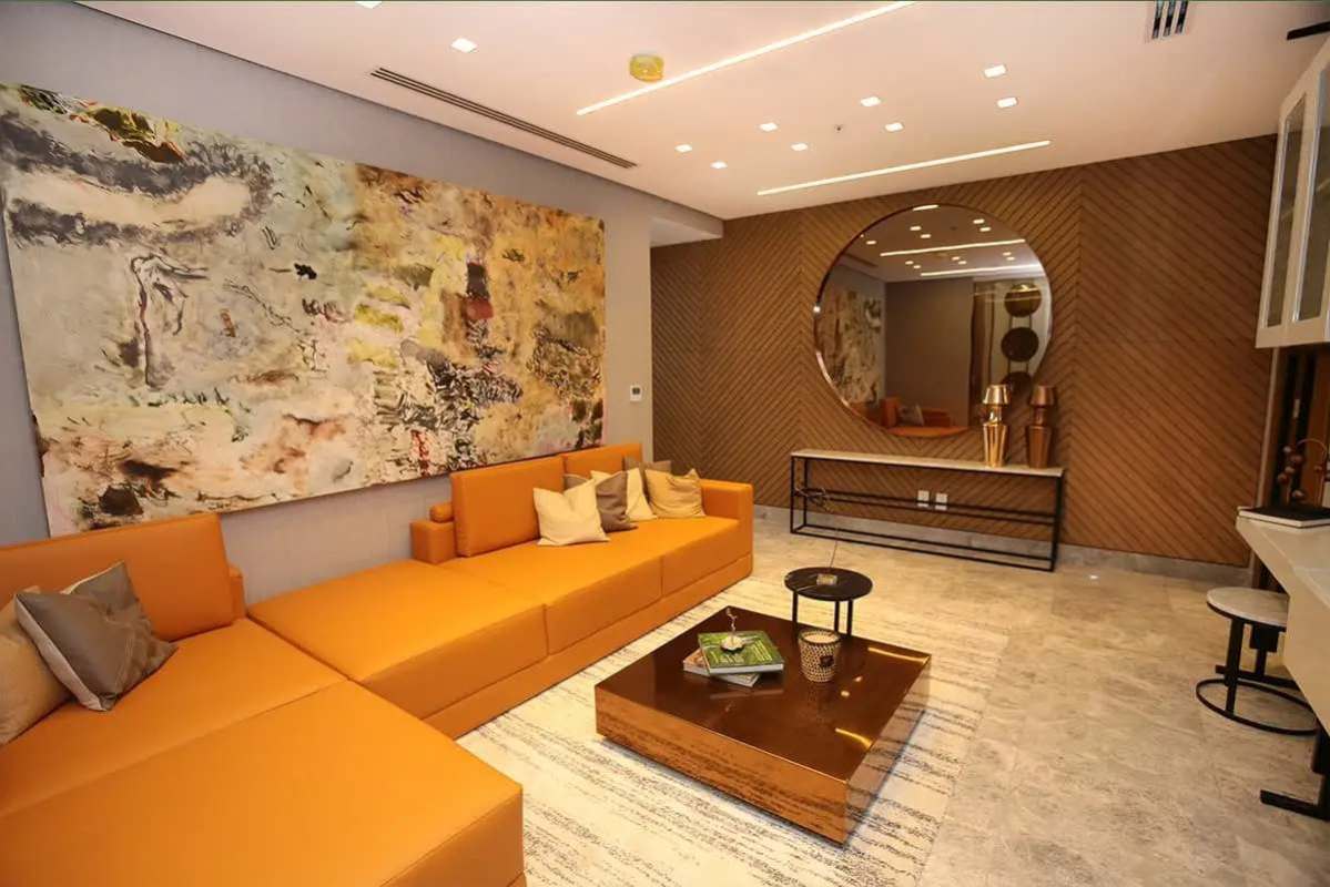 Spacious luxury living room with marble floors and city views Empire Residences Santa Maria