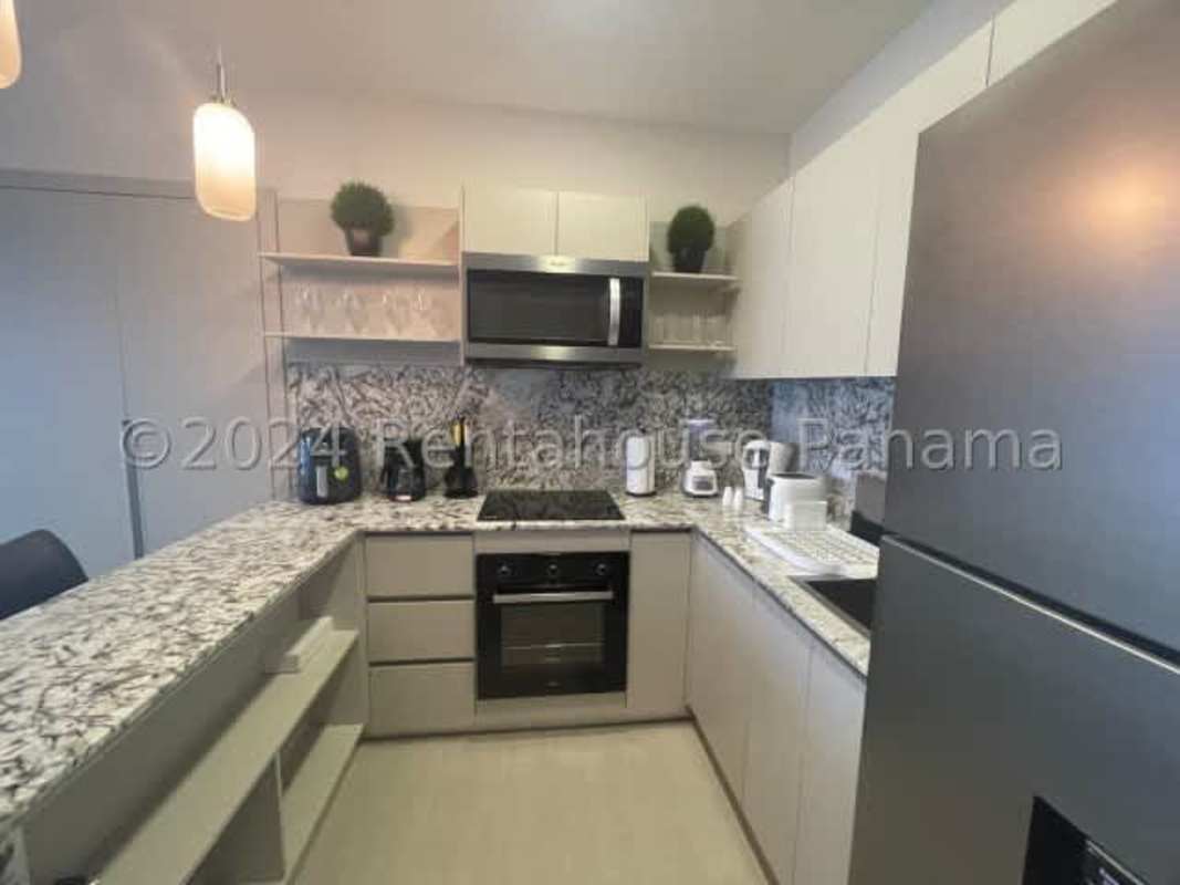 Bedroom with porcelain floors, built-in closet, balcony access at PH Midrise Costa del Este