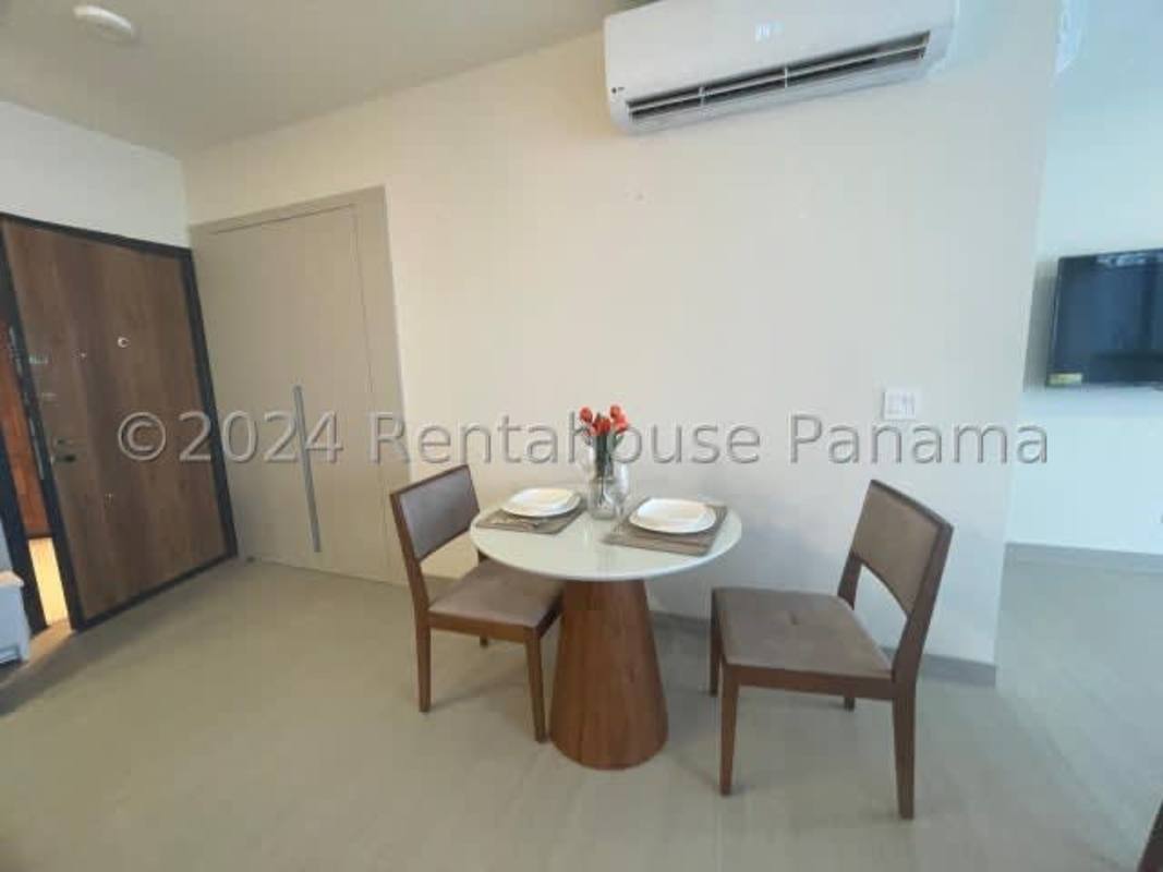 Double-height lobby with designer details and concierge at PH Midrise Costa del Este Panama