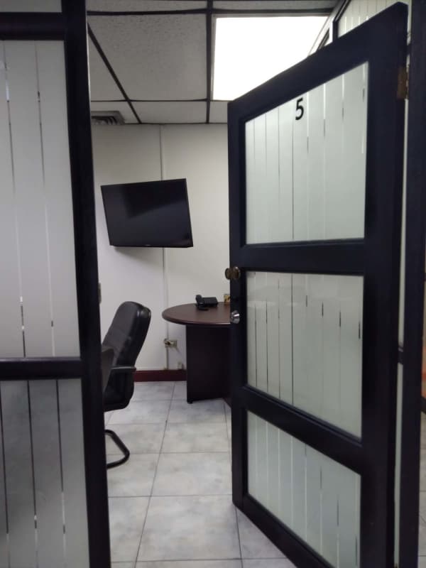 Small private office with glass desk and chair modern style Plaza 2000 tower Panama City