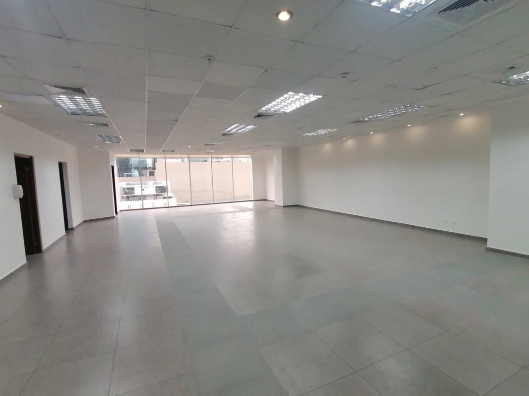 Open plan office with tiled floors, natural light, neutral design in PH Office One Obarrio Panama